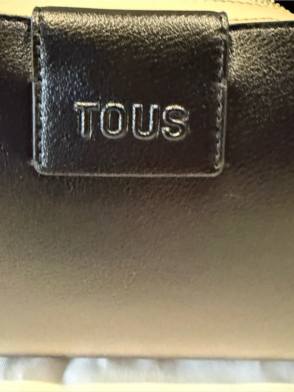 TOUS Black Leather Crossbody Bag with Cream Interior Accent